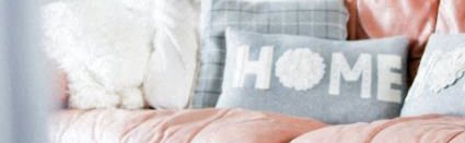 Image of HOME pillow on pink couch